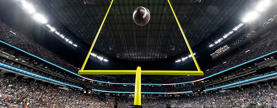 Field Goal Posts in a large indoor football stadium during a gam - Lisa D. Foster, Leadership Coaching & Training perfect field goal as a metaphor for coaching goals and leadership goals